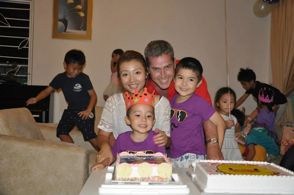 jaime celebrating a childhood birthday with family in singapore