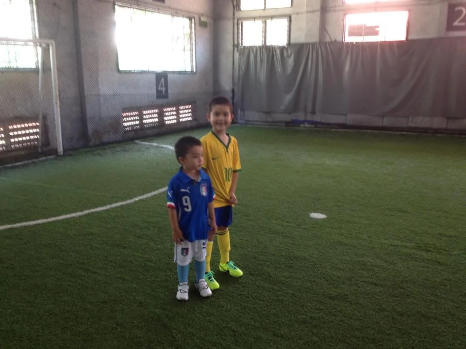 jaime helping a teammate up during a soccer match